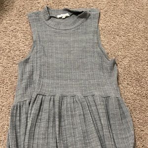 Maurice’s grey tank top
